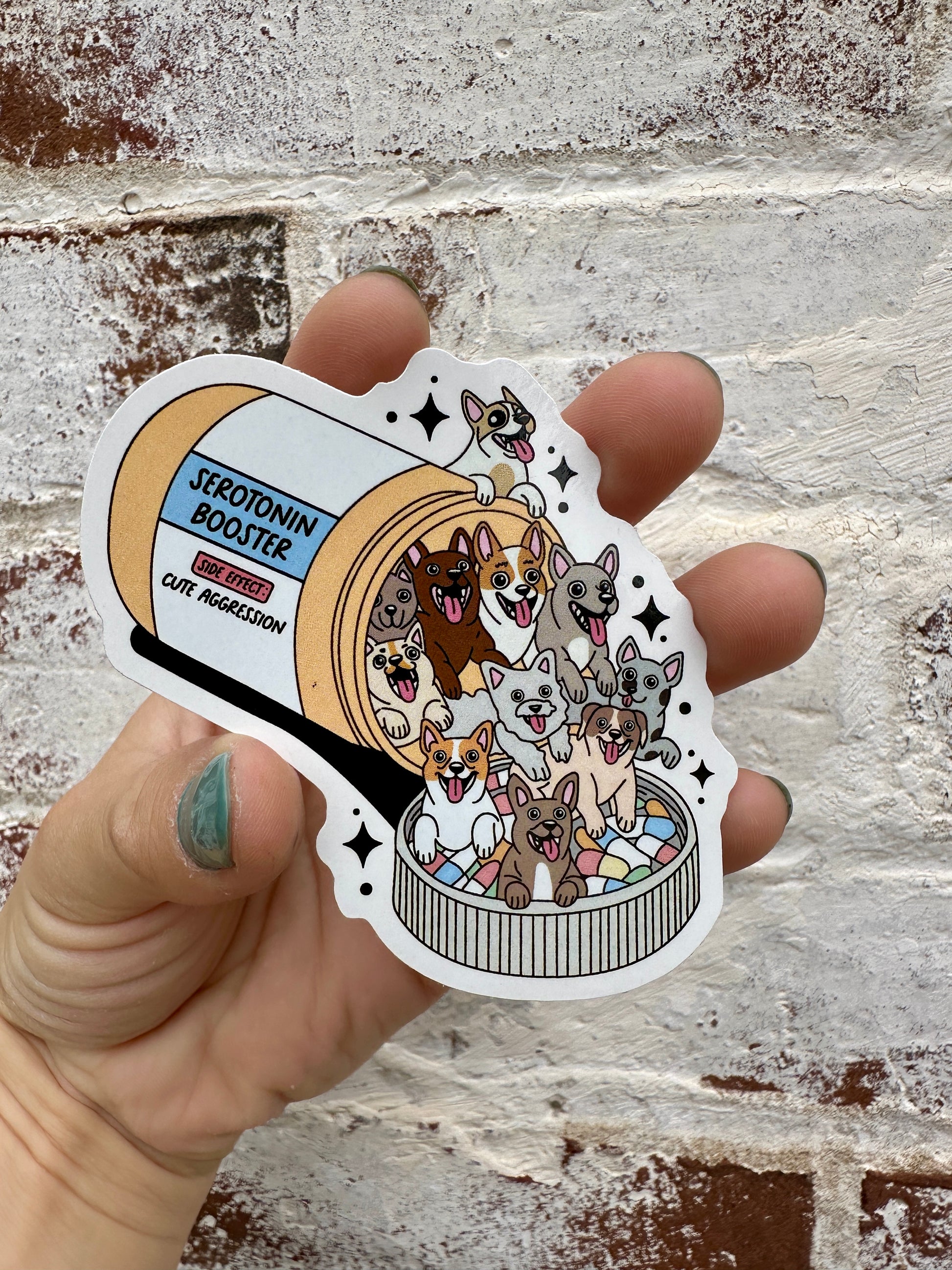 Sticker of a 'Serotonin Booster' can with dogs on a textured wall background